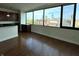 Bright living room with hardwood floors featuring a stunning cityscape view with lots of natural light at 225 N New Jersey St # 46, Indianapolis, IN 46204