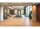 Elegant building lobby with modern tile flooring, plants and plenty of natural light at 225 N New Jersey St # 46, Indianapolis, IN 46204