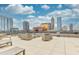 Rooftop patio featuring outdoor seating and a view of downtown at 225 N New Jersey St # 46, Indianapolis, IN 46204