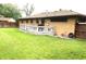 A backyard showcasing a well-maintained lawn and a wooden deck at 2315 Redfern Dr, Indianapolis, IN 46227