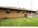 Expansive backyard featuring a well-maintained lawn and a charming wooden deck perfect for outdoor entertaining at 2315 Redfern Dr, Indianapolis, IN 46227
