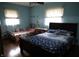 Cozy bedroom with two beds and light-filled windows for a peaceful atmosphere at 2315 Redfern Dr, Indianapolis, IN 46227
