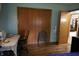 Bright bedroom featuring a desk, sewing machine, and ample closet space at 2315 Redfern Dr, Indianapolis, IN 46227