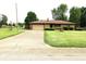 Lovely ranch home featuring a driveway, attached garage, and well-kept lawn at 2315 Redfern Dr, Indianapolis, IN 46227