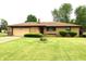 Well-maintained ranch home with an attached garage and a beautifully landscaped yard at 2315 Redfern Dr, Indianapolis, IN 46227