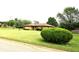 Charming brick ranch home featuring a lush lawn and mature landscaping at 2315 Redfern Dr, Indianapolis, IN 46227