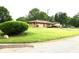 Spacious yard showcasing a well-maintained landscape and a charming brick home at 2315 Redfern Dr, Indianapolis, IN 46227