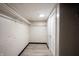 This basement closet has wooden clothing racks and a neutral colored wall at 2740 Pawnee Dr, Indianapolis, IN 46229