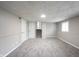 This carpeted basement has a staircase and neutral colored walls at 2740 Pawnee Dr, Indianapolis, IN 46229