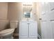 Cozy bathroom features a modern white vanity, sink, and updated light fixture at 2740 Pawnee Dr, Indianapolis, IN 46229