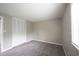 This bedroom has neutral colored walls, soft carpet and ample closet space at 2740 Pawnee Dr, Indianapolis, IN 46229