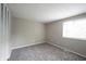 The bedroom is carpeted and has a window for natural light and a closet for storage at 2740 Pawnee Dr, Indianapolis, IN 46229
