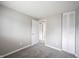Bedroom featuring neutral carpet and paint, a closet and an open door at 2740 Pawnee Dr, Indianapolis, IN 46229