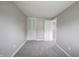 This carpeted bedroom has a closet and an entrance to another room at 2740 Pawnee Dr, Indianapolis, IN 46229