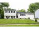 Charming split-level home with a well-manicured lawn and attached one car garage at 2740 Pawnee Dr, Indianapolis, IN 46229