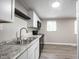 Updated kitchen with stainless steel sink, granite counters and modern appliances at 2740 Pawnee Dr, Indianapolis, IN 46229