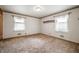 Cozy bedroom with classic carpet, featuring bright windows and neutral walls, providing a warm atmosphere at 301 N Kitley Ave, Indianapolis, IN 46219