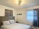 Primary bedroom with a modern bed frame and relaxing decor at 310 Styleline Dr, Mooresville, IN 46158
