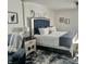 Inviting bedroom with stylish decor, a plush bed with blue accents, and comfortable furnishings at 310 Styleline Dr, Mooresville, IN 46158