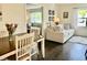 Bright dining area with view into living room, hardwood floors and natural light at 310 Styleline Dr, Mooresville, IN 46158
