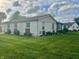Charming single-story home with a light-colored brick exterior and well-manicured lawn at 310 Styleline Dr, Mooresville, IN 46158