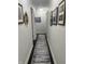 Long hallway with dark hardwood floors and freshly painted walls at 310 Styleline Dr, Mooresville, IN 46158