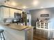 Modern kitchen with stainless steel appliances, custom cabinets, and sleek countertops at 310 Styleline Dr, Mooresville, IN 46158