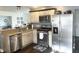 Well-lit kitchen featuring stainless steel appliances, custom cabinets, and modern countertops at 310 Styleline Dr, Mooresville, IN 46158