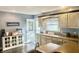 Bright kitchen with custom cabinets, a view to the yard, and stainless steel appliances at 310 Styleline Dr, Mooresville, IN 46158