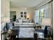 Bright living room features complementary furniture, decor, and natural light at 310 Styleline Dr, Mooresville, IN 46158