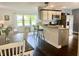 Cozy open concept living space with modern kitchen and dining area with lots of natural light at 310 Styleline Dr, Mooresville, IN 46158