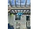Charming patio with a wooden pergola and string lights, perfect for outdoor relaxation and entertainment at 310 Styleline Dr, Mooresville, IN 46158