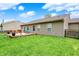 Expansive backyard with a wooden deck and lush green lawn at 3214 Limber Pine Dr, Whiteland, IN 46184