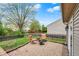 Spacious backyard with a brick patio and cozy seating area at 3214 Limber Pine Dr, Whiteland, IN 46184