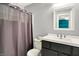 Bathroom with granite sink and cabinet, mirror with modern purple shower curtain at 3214 Limber Pine Dr, Whiteland, IN 46184