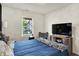 Well-lit bedroom with a cozy bed, large window overlooking the neighborhood, and mounted TV at 3214 Limber Pine Dr, Whiteland, IN 46184