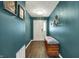 Stylish entryway with wood-look flooring, bench seating, and decoratively painted walls at 3214 Limber Pine Dr, Whiteland, IN 46184