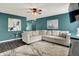 Spacious living room with comfortable sectional sofa, modern décor, and stylish accent wall at 3214 Limber Pine Dr, Whiteland, IN 46184