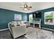 Inviting living room featuring a modern fireplace, comfortable sectional sofa, and bright natural light at 3214 Limber Pine Dr, Whiteland, IN 46184