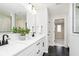 Elegant bathroom with a double sink vanity, modern fixtures, and a view into the adjacent room at 3226 Promenade Way, Brownsburg, IN 46112