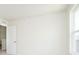 Sunlit bedroom featuring a window and a white door, offering a serene and inviting space at 3226 Promenade Way, Brownsburg, IN 46112