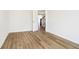 A bedroom with wood floors featuring a door opening to the stairs at 3226 Promenade Way, Brownsburg, IN 46112