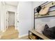 Welcoming entryway with a bench, coat hooks, and a view into other rooms, offering convenience and style at 3226 Promenade Way, Brownsburg, IN 46112