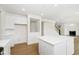 Bright kitchen featuring a center island with pendant lighting, stainless steel appliances, and ample storage at 3226 Promenade Way, Brownsburg, IN 46112