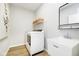 Functional laundry room with modern washer and dryer, a deep utility sink, and ample storage at 3226 Promenade Way, Brownsburg, IN 46112