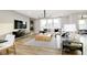 Light-filled living room showcases stylish decor, hardwood floors, and a comfortable seating area at 3226 Promenade Way, Brownsburg, IN 46112
