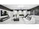 Spacious living room with a large sectional sofa, stylish decor, and plenty of natural light for comfortable living at 3226 Promenade Way, Brownsburg, IN 46112
