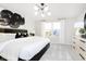 Serene main bedroom with a plush bed, modern lighting, and a view of the outdoors for a relaxing retreat at 3226 Promenade Way, Brownsburg, IN 46112