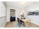 Contemporary office featuring a wooden desk, stylish shelving, and an open doorway to the rest of the home at 3226 Promenade Way, Brownsburg, IN 46112