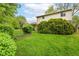 View of the yard showing the home's exterior and well maintained landscaping at 3325 Broadview Ct, Indianapolis, IN 46227